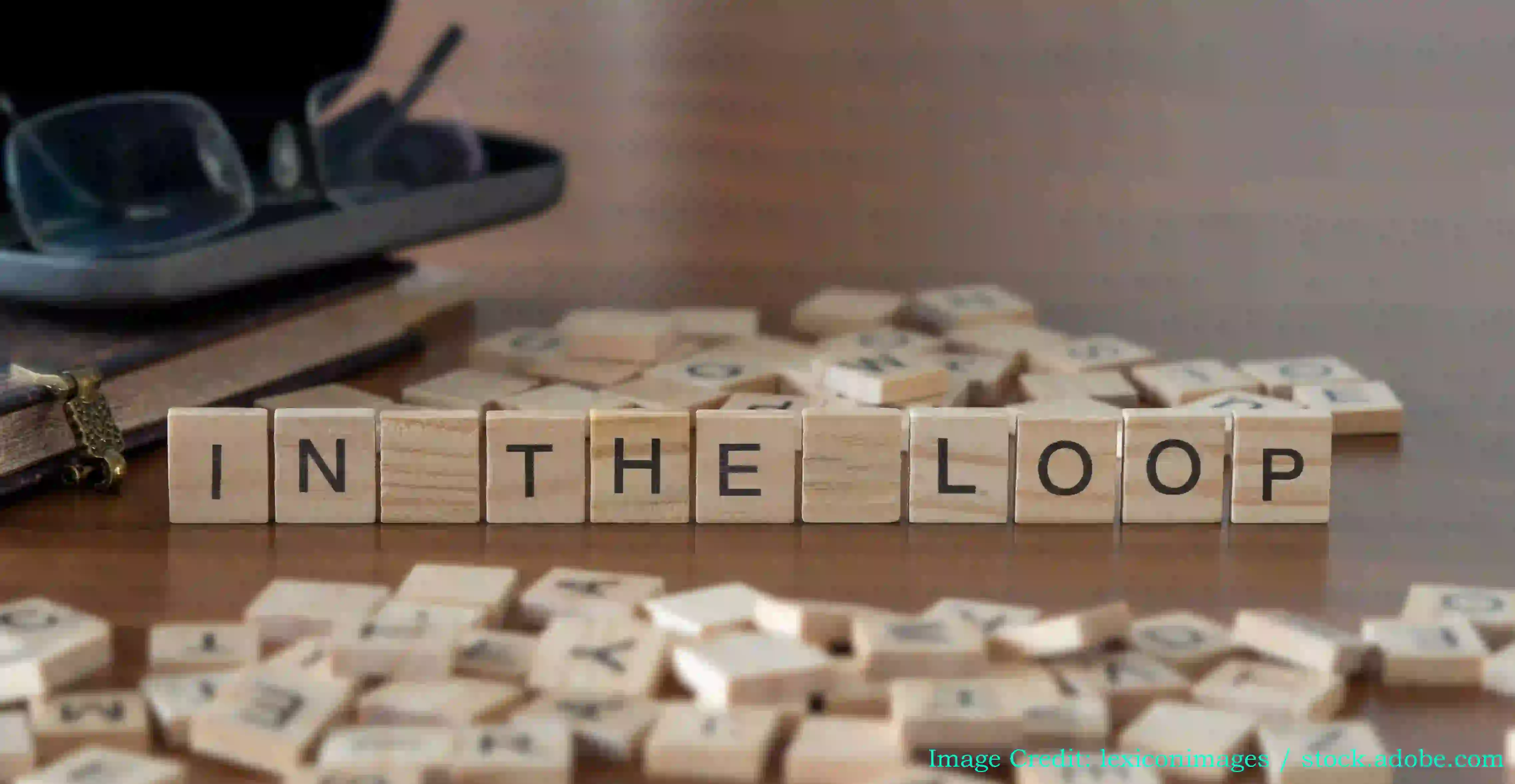 Wooden blocks spelling out IN THE LOOP